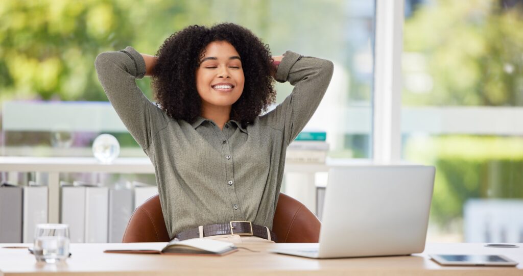 Black woman in business, relax in office and stress relief, content and peace with career satisfact